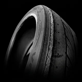 Tire with the inner edge worn down to the exposed steel cords